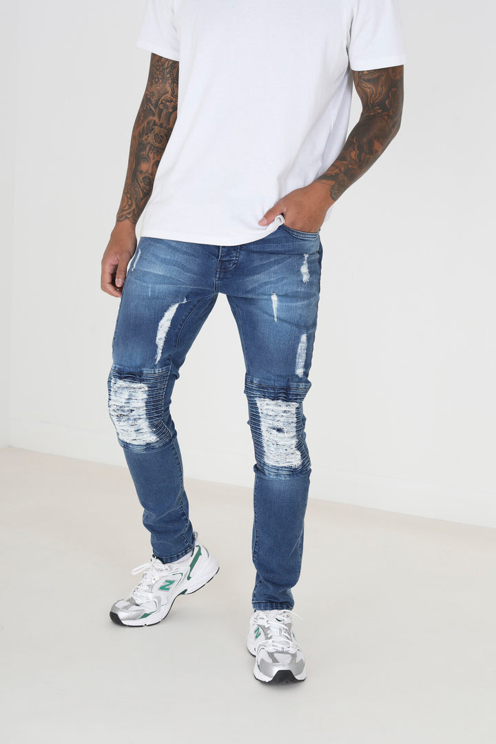 MID BLUE BIKER STYLE ZIP DETAIL RIPPED DENIM JEANS